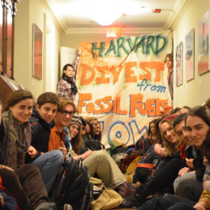 Divest Harvard holds a sit-in outside President Drew Faust's office (via Twitter)